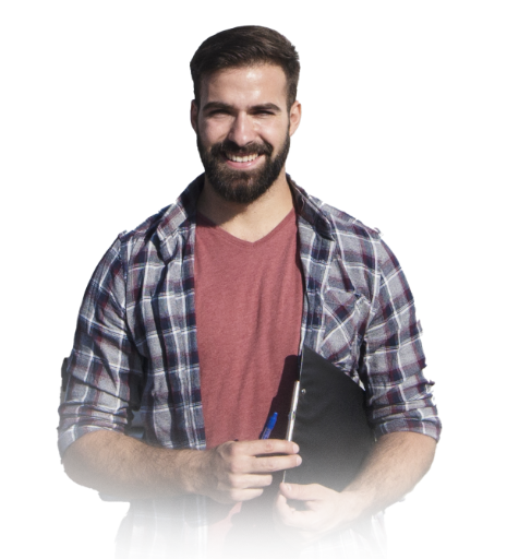 A man with a beard, dressed in a plaid shirt, is holding a notebook, suggesting a moment of reflection or creativity.